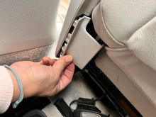 That inner trim piece extends to the rear of the seat. Detach as well. Use a little force. 