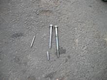 Broken head bolt out, compared to a whole one.