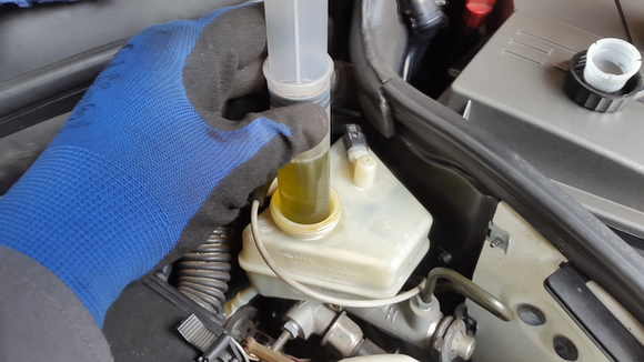 First remove some of the brake fluid just so you can make room for the new fluid.