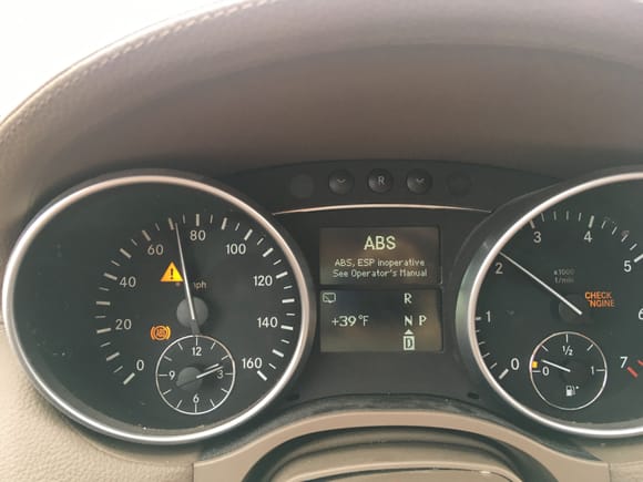 ABS/ESP lights coming on while driving on a rainy day in the highway.