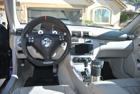 Installed a few nice CF dash, console & door upgrades, including flat-bottom alacantra leather steering wheel.