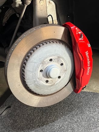 Driver side EQS SUV caliper painted with G2 Mustang Torch Red epoxy.