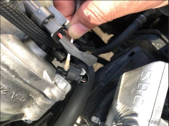 Oil in this connection, closest to the lower Camshaft Position Sensor & Adjuster Magnet on the passenger side