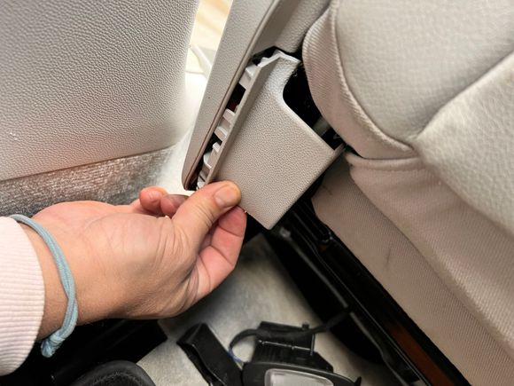 That inner trim piece extends to the rear of the seat. Detach as well. Use a little force. 