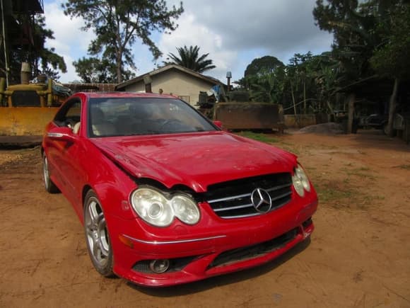 My CLK takes its final bow as a red car, under scattered cloud cover that promises rain showers before long.  Lurking at rest in the background are a D6D LGP, and D7G LGP Cat dozers used to excavate catfish ponds when the rains taper off come November.