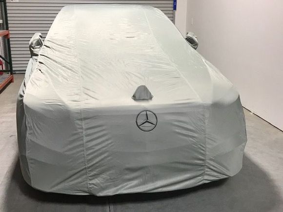 it is real, I believe is the same as the one I use for my S65, just different color, factory car covers fits like a glove.