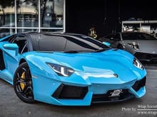 This is a picture of a car in 3M Sky Blue Wrap