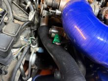 The revised pathway for the coolant hose no longer rubs against hard lines/engine bay.  

I deleted my charcoal canister with the hopes of routing my intake to the passenger side of the engine bay. 
