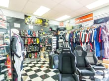 Stable Energies retail store. Here is our driver apparel section. Customers are able to try on Driving Suits from Alpinestars & OMP. As well as gloves and driving shoes.