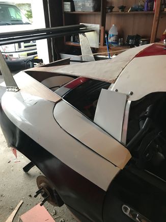 Maybe using aluminum flashing to fill the gaps. Or plywood. In any case, you can see how much narrower the fastback is at the front edge. I’m hoping it helps keep the wind out of the cabin. We have to race with windows open.