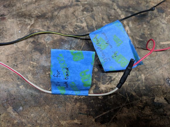 The White and red wire is labeled 12v for wideband and the black is ground for wideband.