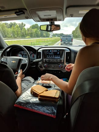 GF making me sandwiches fulfilling her duties as a female in the relationship during the trip down to NC while fellow Miata convey riders suffer without A/C :)