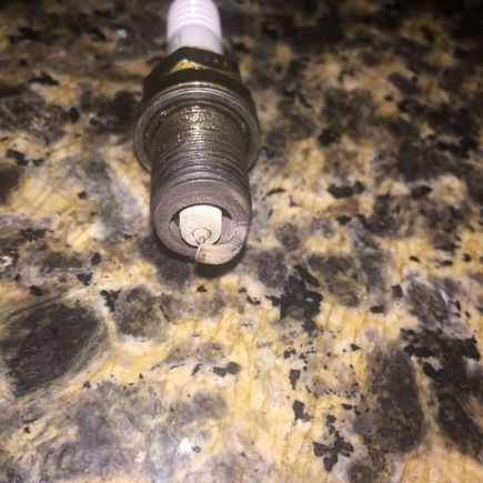 Thought a on the plug ?? All 4 are similar to this, they have around 20k miles .You can't tell from the picture but it's sort of grayish grainy looking