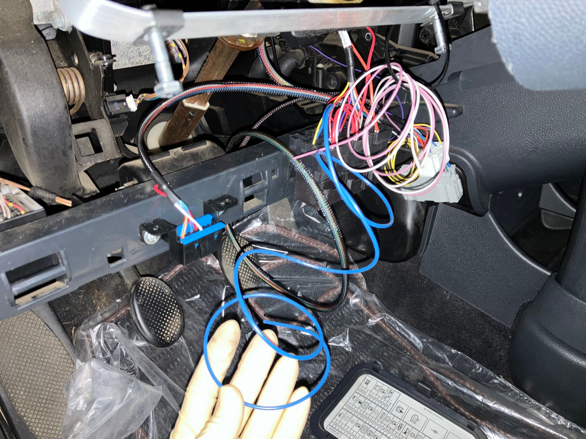 On the swap harness there will be a blue wire. This is responsible for the fuel pump power. This may come easy to some but for me it was hard to wrap my mind around it but what this swap harness is doing is essentially bypassing the MINIs factory fuel pump relay. What then has to be done the fuel pump power wire (blue) has to be connected to the power wire of the MINI fuel pump. The easiest way to do this is to jump it off the passenger fuse box on the drivers side kick panel.