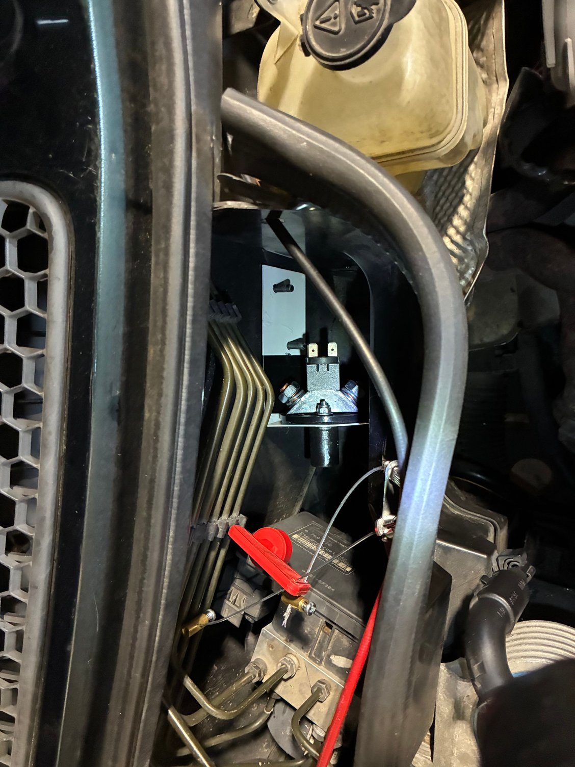 you can see the two studs here, bracket is in white, switch does not have the key inserted.