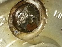 Of course one of them stripped because the socket was only on about 1/4".  This is what it looked like after I got done heating it and beating on it with a hammer & chisel.