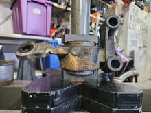 Another image of the new bushing being pressed into place.  The removed bushing was evenly seated in the bracket (see the next image for confirmation) - this image highlights how the version of the on-vehicle installation tool did not have evenly matched plates for installing a new bushing.