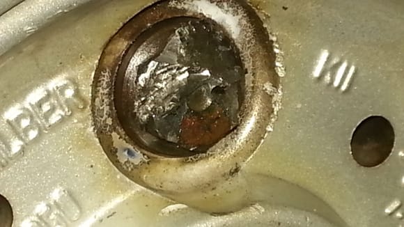 Of course one of them stripped because the socket was only on about 1/4".  This is what it looked like after I got done heating it and beating on it with a hammer & chisel.
