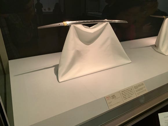 samurai swords are displayed with the cut side up