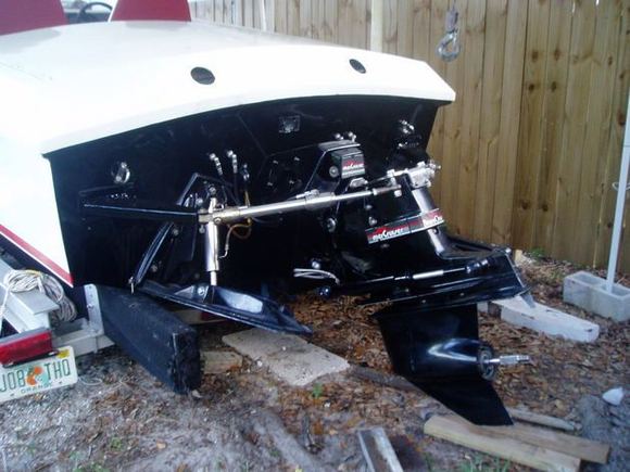 I Made some Stainless brackets for the steering to hook to, 36" K Planes... mean rear end on just a 24' baot