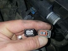 EV1 adapter on left, plug from truck harness on right
