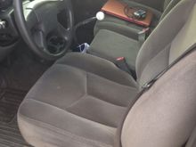 Finished the interior today. Reinstalled my middle seat, transplanted cup holders, installed dynamat across the back and rigged up a shifter boot with an old crown bag.