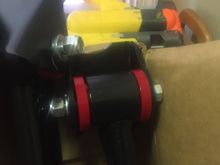 Some bright red bushings!!!! Why cant the send black bushings?? I hope the brackets pull in a bit when they get tightened up, to take up some of the slack between the sides of the bracket and the bushings!! Last time i had something with poly bushings, i had to lube the bushing to get them to go in and then the spacer that went in hardly went in without trying to push the other side out.... These almost fell in and spacer slid in with no issues.....