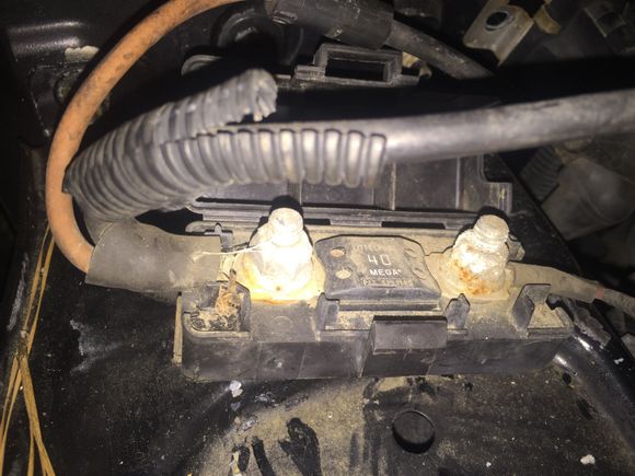 This is fuse block on the battery tray the two wires on left go to the battery and the orange to the relay....the one on the right goes to the fuse box across the firewall