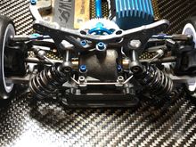 Rear suspension using ARC dampers and offset from the tower to clear the roll bar.