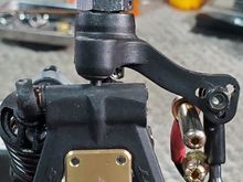 To use the front steering upright in the rear, you only need to trim the nub off the lower rear arm where the pivot ball installs. Just remember that when setting your car width you will now use the front settings in the rear.