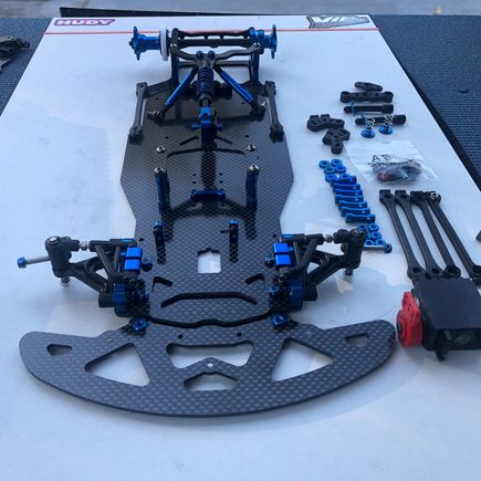 Here is the ae 10r5.1. It is missing the side plates to mount the side dampeners part number 8601 and also the side rails. Spare chassis bumper and front arm mount plate. You could find an old 12r5.2 and build another 10r5.1