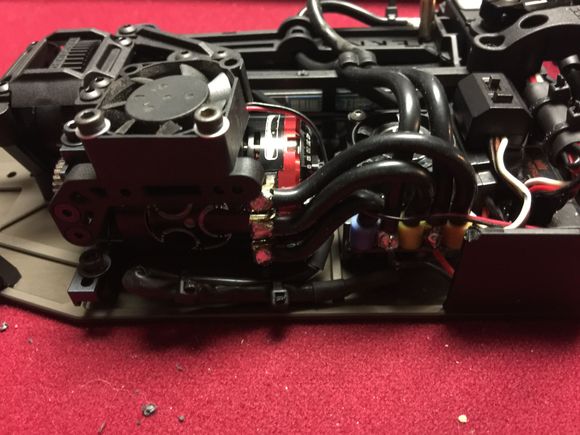 Two extra holes drilled onto of stock mount...voila. 
Maybe Tekno should just do that from the start!?!