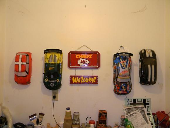 The wall o' bodies in the shop. Please ignore the my pitiful NFL logo on the wall. Yes I know they are sucking, lol. Also the German symbols go to a Me-262 RC jet yet to be applied.