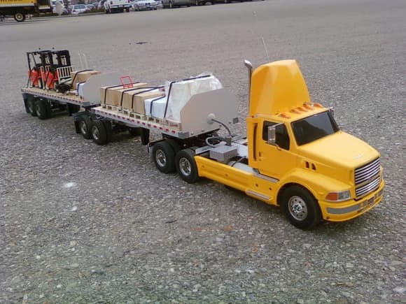 my daycab aeromax with my flatbed b-trains fully loaded and yes the forklifts are radio control also