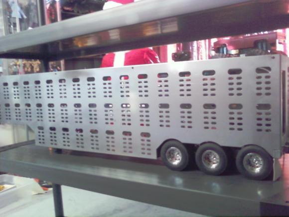 my all steel triaxle cattle trailer which weighs in at 38 lbs very heavy but not for my tamiya tractors