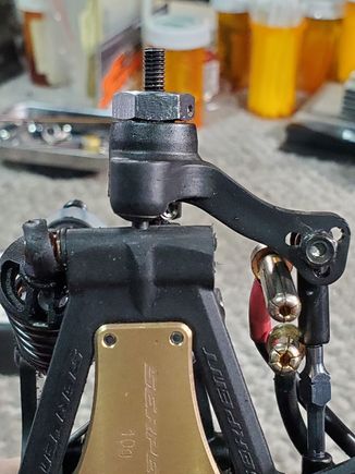 To use the front steering upright in the rear, you only need to trim the nub off the lower rear arm where the pivot ball installs. Just remember that when setting your car width you will now use the front settings in the rear.