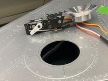 Landing light assembly with opening in wing