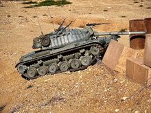 Modified the elevation system to allow for fighting from the hull down position. Very hard to hit the IR receiver while battling in undulating terrain that allows for this firing position. 