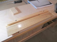 I secured the flap to my work table with simple pine scraps to make sure it wouldn't move.  The top piece of pine strip will also act as a stop for the router to ensure that each corrugation will be the same length.