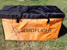 This bag has 2 hand straps and clip on shoulder strap to carry you wings and load them to the flying field.