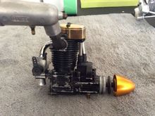 Typical 50 and 56 LS needle setting, about 1/16th" below throttle arm face. 1/8 turn rich from lean hesitation is about perfect.