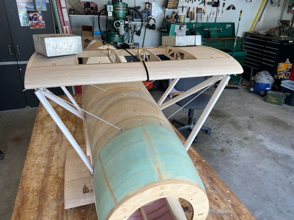 The weights on top are redundant but seemed like a good idea anyway.  I remeasured everything for plumb (it's perfect), but there really wasn't anything to be done about it at this point!