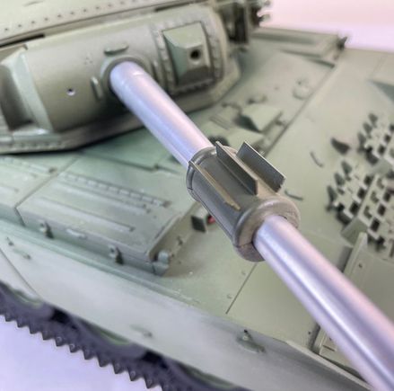 The vanes on the barrel evacuator are weights to balance the shortened 50 cal RMG, which displaces the coax from it's usual place, necessitating a new port between the RMG & main gun - missing in this shot