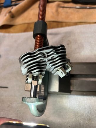 I was surprised to see the retainers were just the same circlips that hold the valve rocker shafts in place.