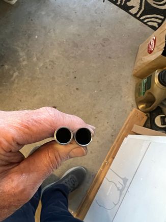 Here are the lower strut tubes.. VERY thin walled.  I made new ones some 4130 steel and got a little more wall thickness to help toughen them up.  look close: the one on the right is stock, left is my new one.