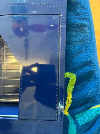 Here you see the necessary clearance gap in the inboard door surface.  You might also notice my bodywork where I ground right thru the bottom of the wing :-O.   It's surprisingly easy to do.