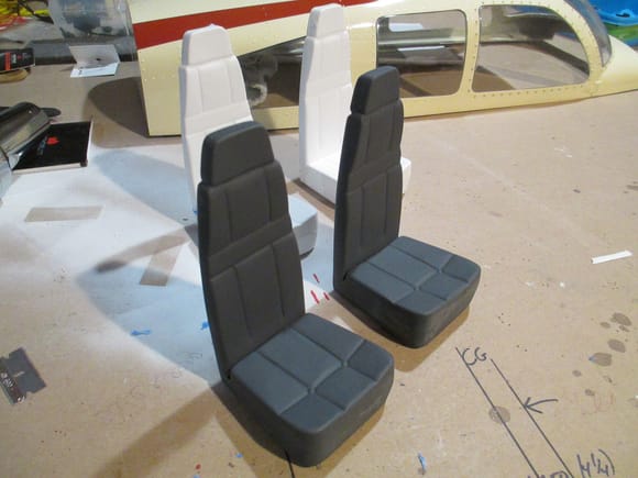Work on the cabin interior is well under way.  All for seats have been assembled, but only the two front seats have been primed.  The two seats in the rear still have a lot of sanding/filling before the primer is sprayed.  