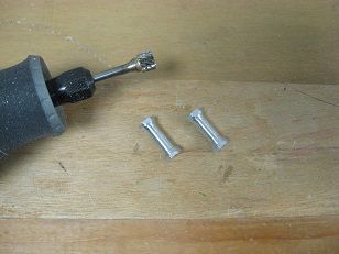 Turned down some 4-40 aluminum hex standoffs on the drill press for center section hatch retention -