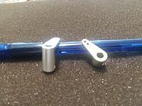 Here are the arms for the Walbro Carb to slide on the brass shafts for throttle and chock.  No need to try to make one from a nose gear steering arm.