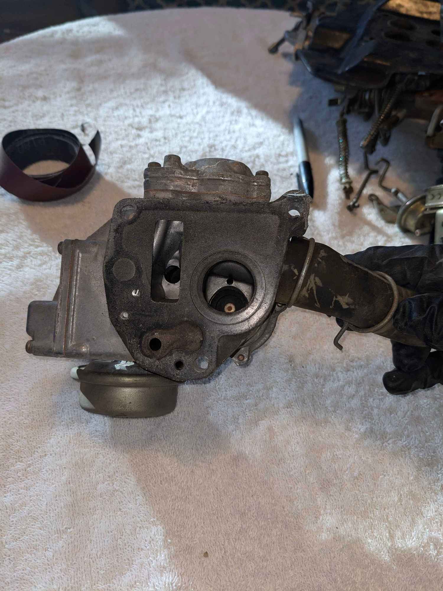 Part 18: Not sure what this is but it looks too big to be on a carb. But it was in the box so it goes into the thread